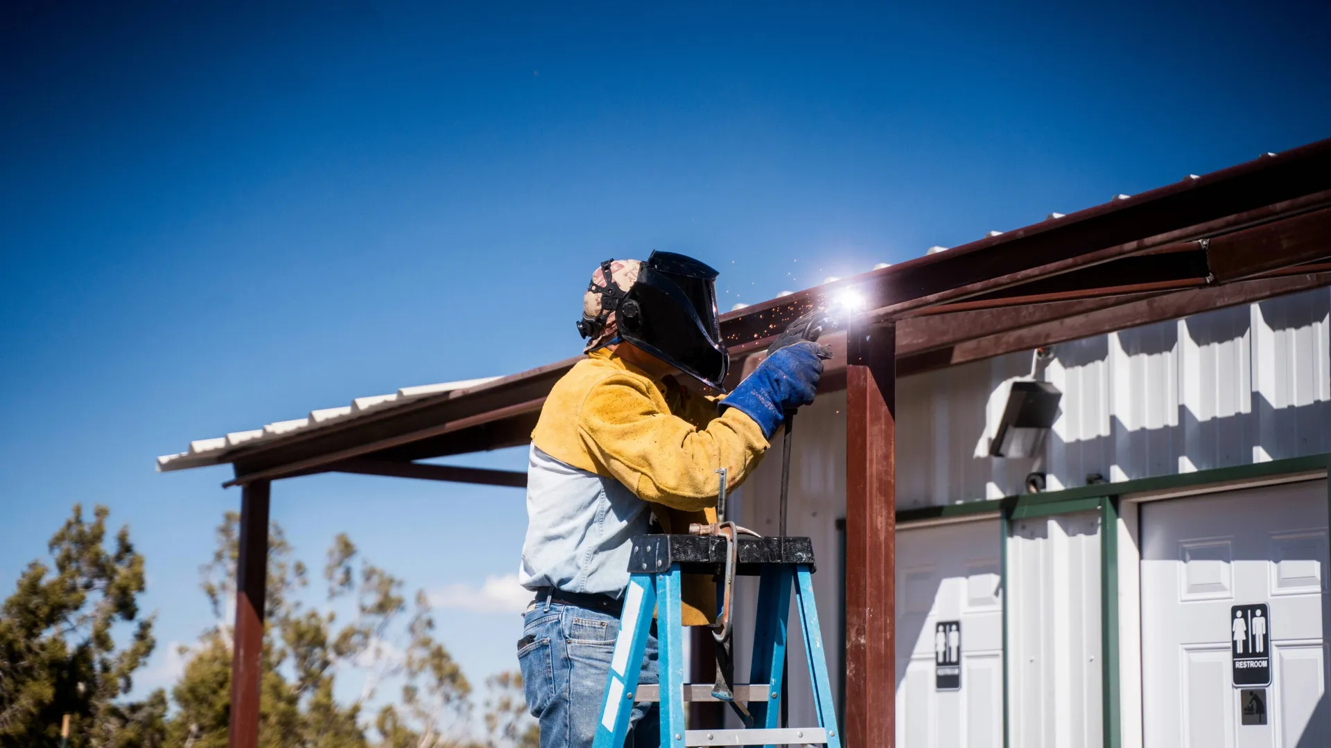 Repairing a metal roof with welding equipment