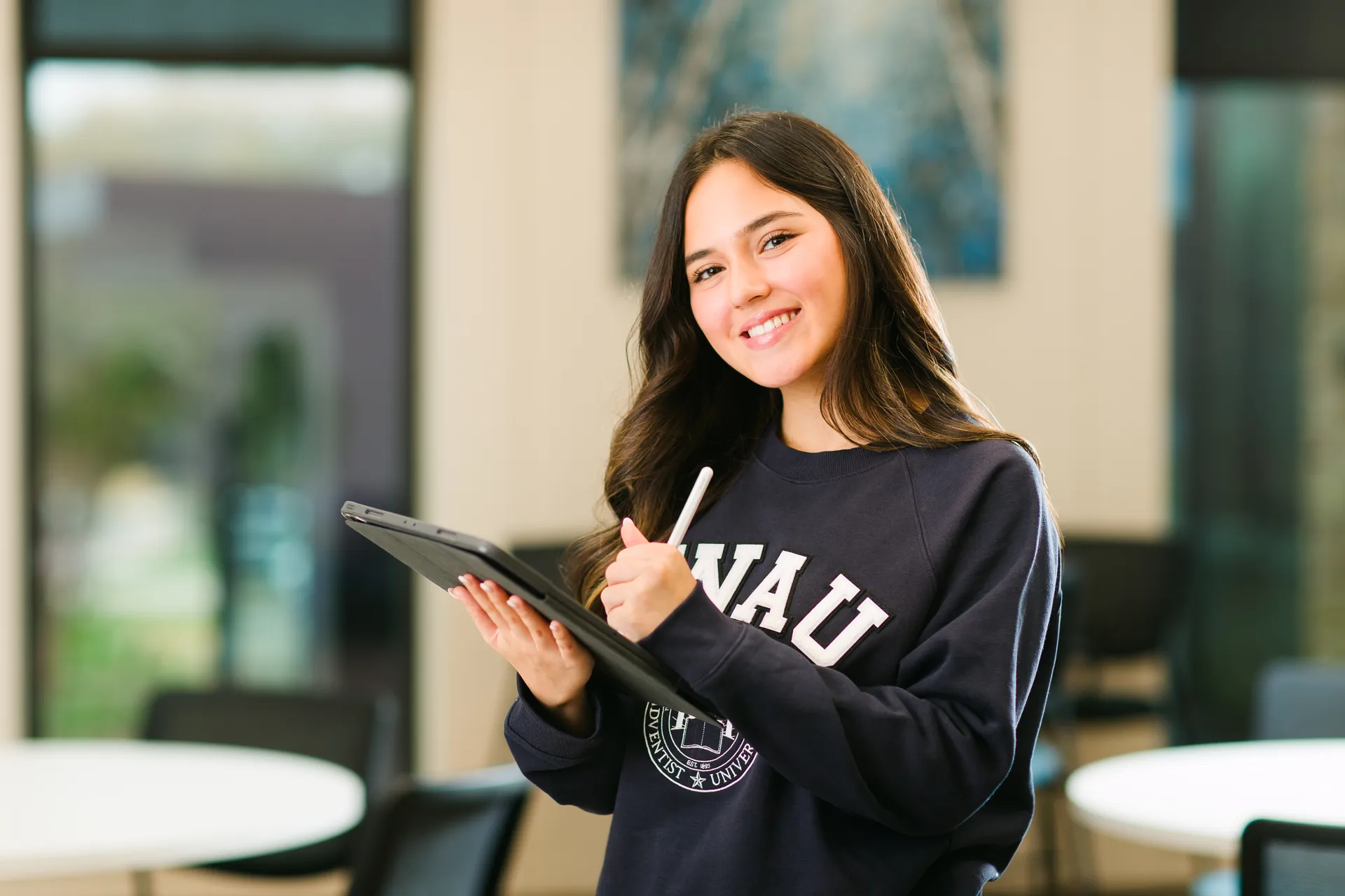 student with tablet and pen
